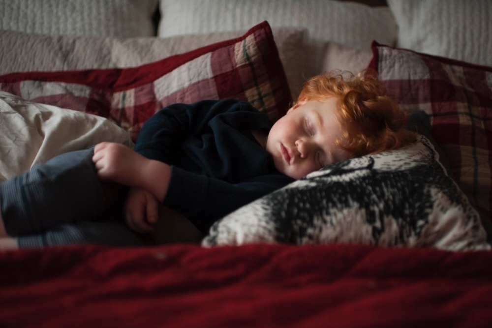 hollow and hill babysitting child sleeping in a bed