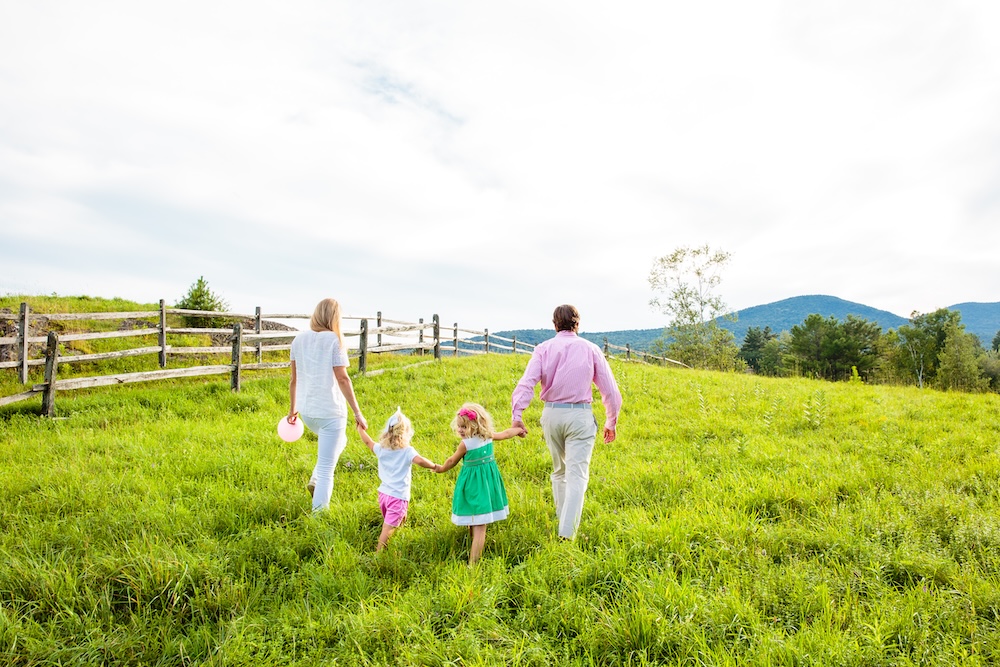 hollow and hill capture moment Family walking in a field in Stowe, Vt