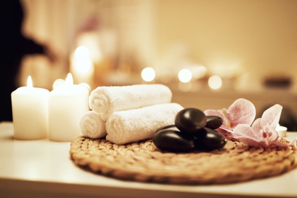 hollow and hill massage Towels, candles and hot stones out for a massage service